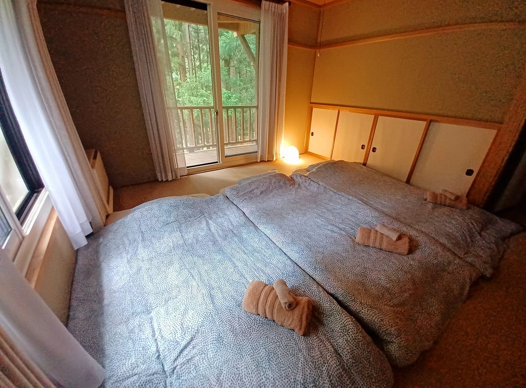 Room with futons for three people.